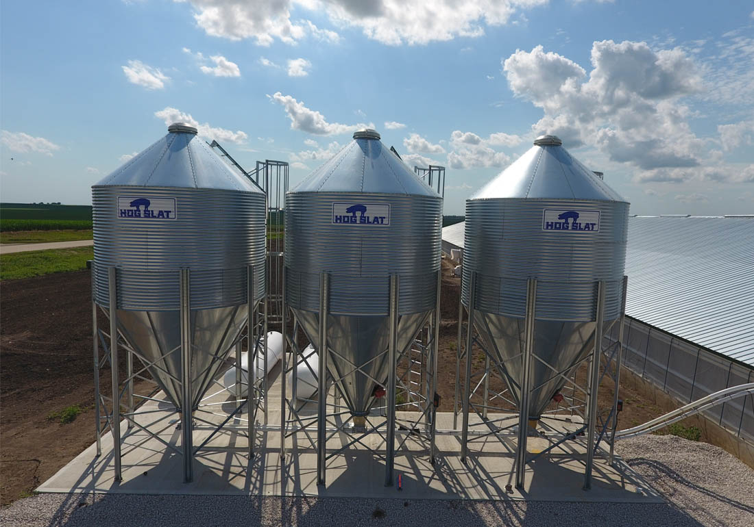  Three 15 ton capacity Hog Slat bulk feed bins with BridgRid anti-bridging systems installed.