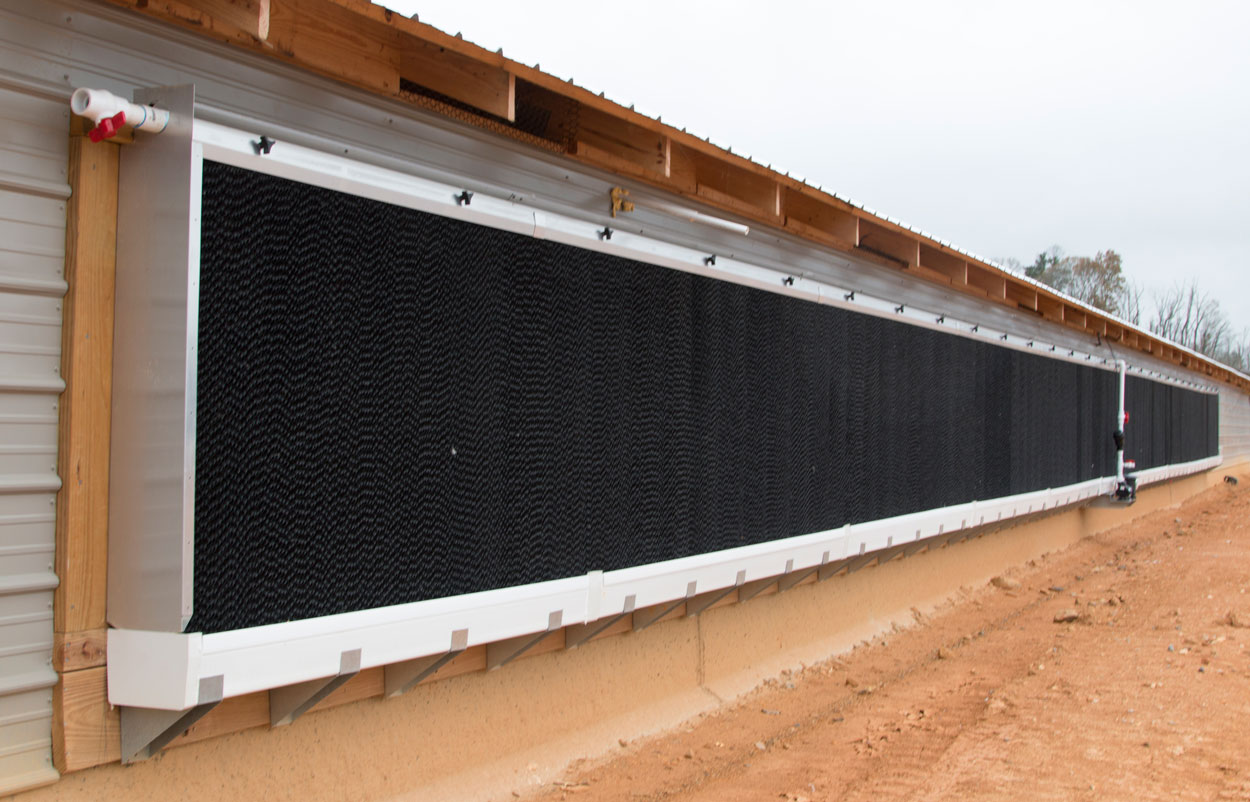 Hog Slat EVAP evaporative cool cell systems are designed with features and improvements that increase performance and reliability for your poultry and swine cooling needs. Our double leg bracket design provides superior support for EVAP systems when attached directly to a barn.