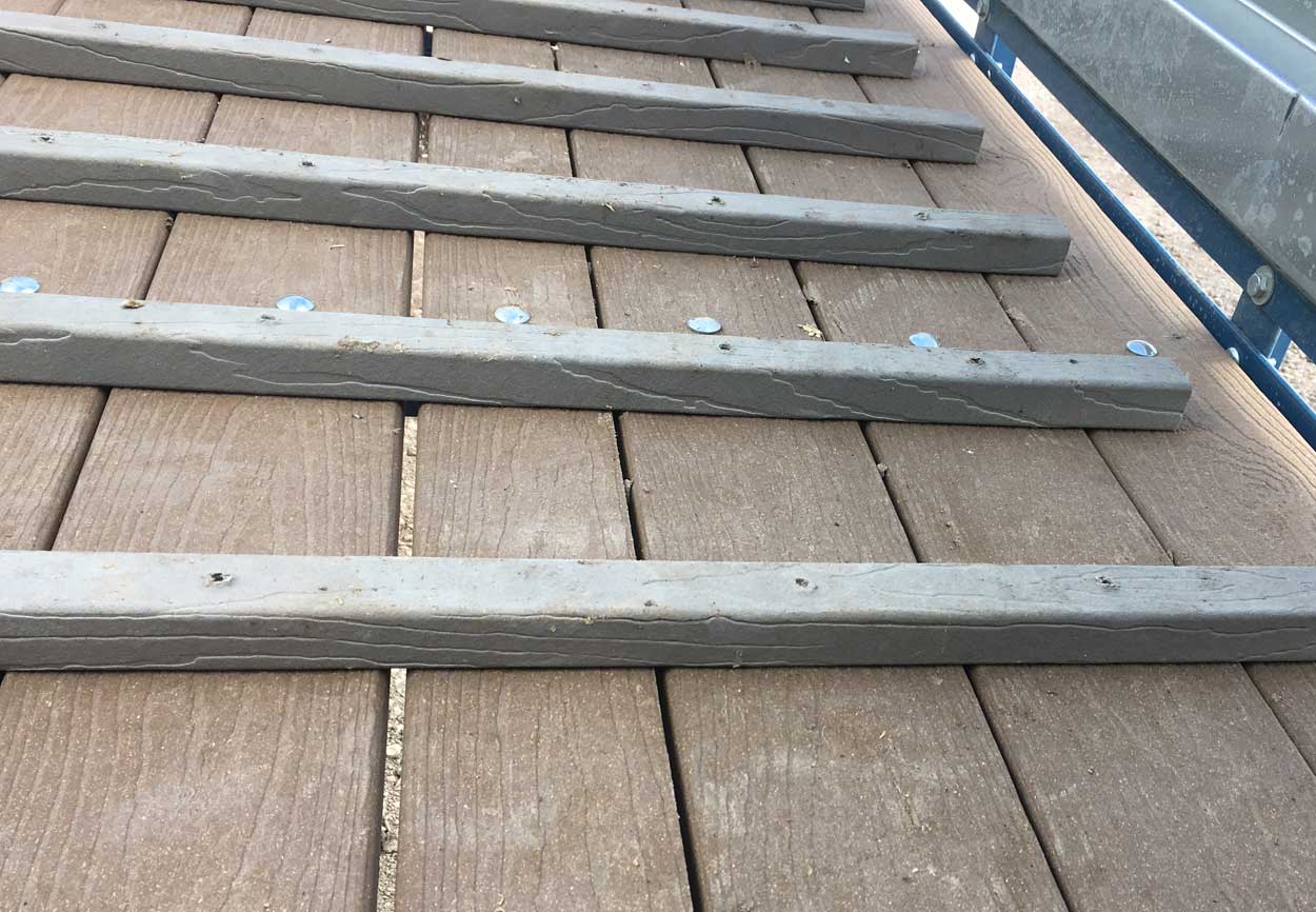 Composite plank options are available on some load chute models, providing an option for flooring material that can stand up to harsh outdoor and operating conditions even better than treated wood planks.