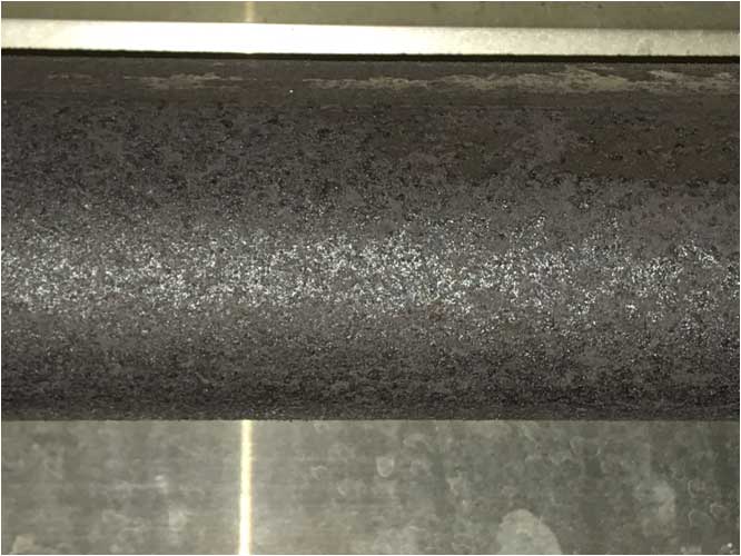A non-aluminized, raw steel rolled tube from a competitor brand radiant tube heater after only two years. Corrosion and pitting on the tube surface will decrease heater performance and expected life span significantly.