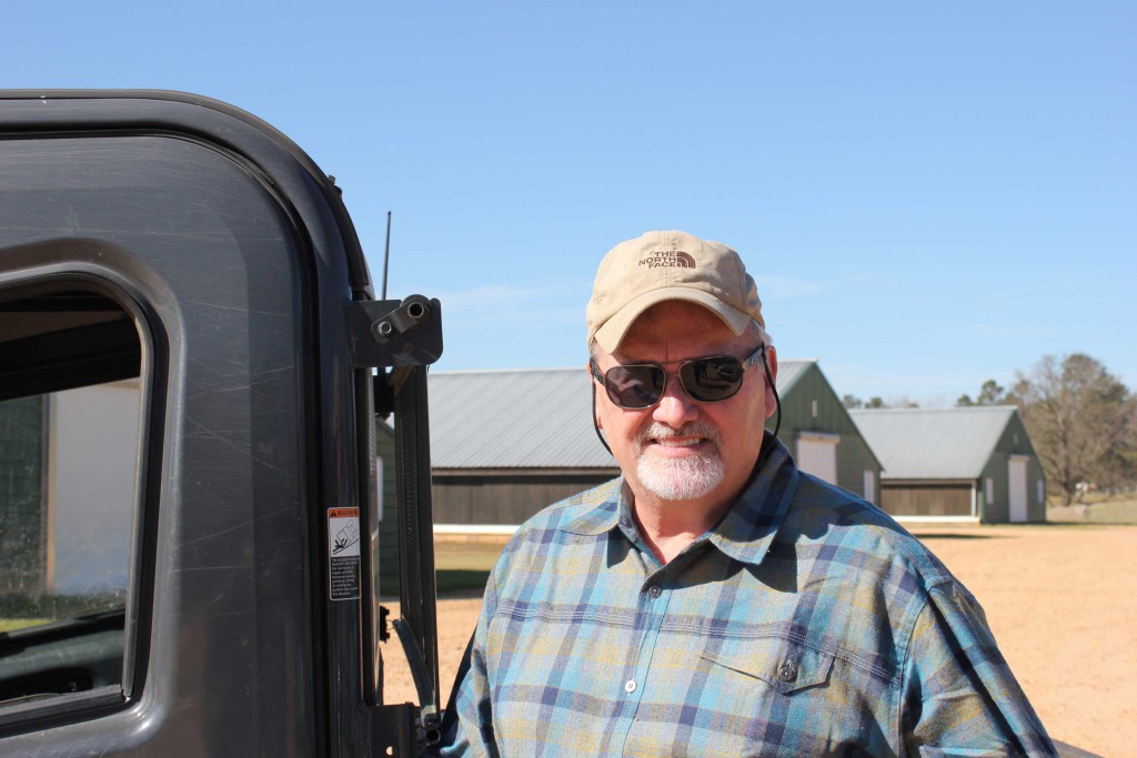Billy Dossett in front of his 4) 44' x 500' Broiler Houses at Windy Hill Farms.